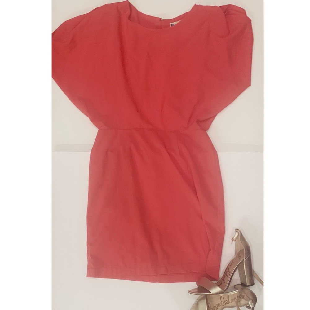 Orange cocktail dress. Cutout back.